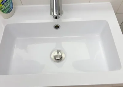 Mayfair team after post renovation commercial cleaning for sink in Aurora, ON